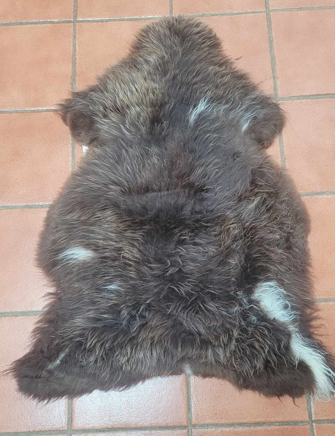 Ethically sourced soft brown sheepskin rug for Hygge and mountain decor