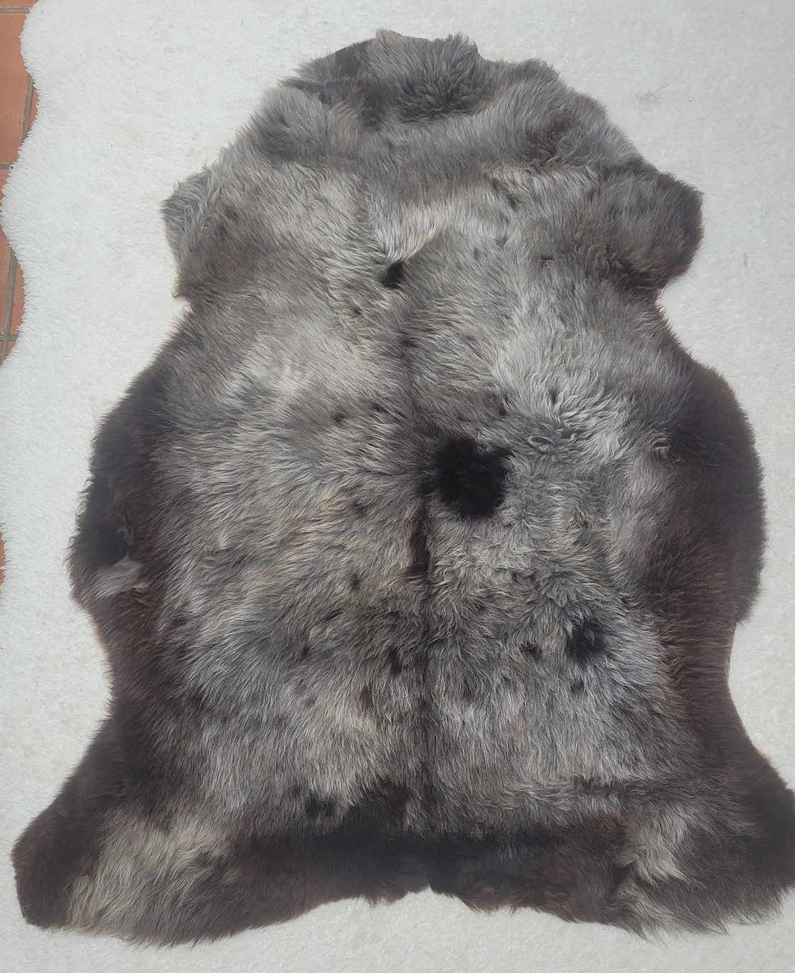 ethically sourced natural sheepskin rug soft brown and black